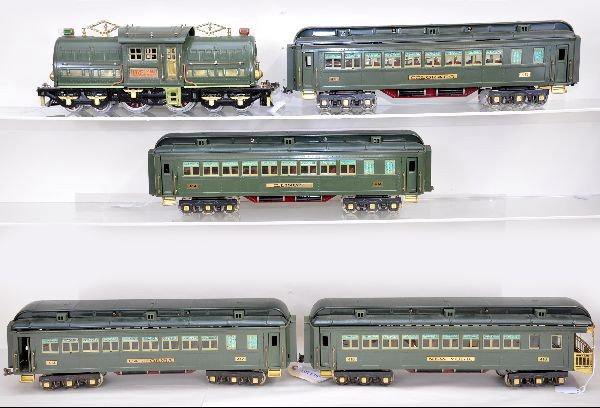 Boxed Williams 381E State Set: Standard Gauge. Early version with Lionel plates, McCoy motor, 4 passenger cars, all with original boxes and wrapping. Shows light wear. C7+-8