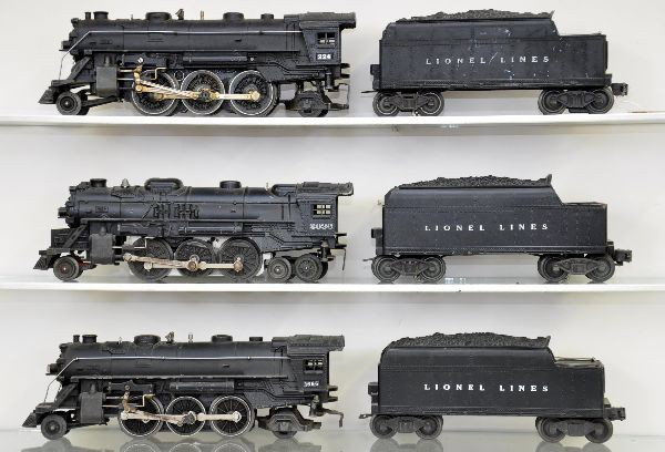 Three Lionel Steam Locomotives: 1666 with a 2466T tender, flying shoe truck incomplete; 2036 locomotive; 6466W tender; 224 locomotive; 2466W tender, has one early flying shoe truck. All show light to moderate playwear, should clean