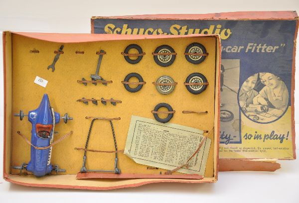 Unusual Boxed Schuco-Studio Race Car Kit: Very unusual to find boxed. Racer has dry and cracked drive wheel and steering wheel has been repaired. Set is missing a tool, key and tire. Otherwise, shows light playwear. C7-8