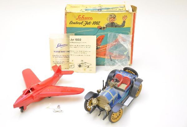 Schuco 1002 and 1225 Vehicle Lot: 1225 Mercer, mechanism is fully functional, missing hood ornament. Boxed 1002 Control-Jet, mechanism functional with tether and instructions. Worn original box. Both show light to moderate playwear, C