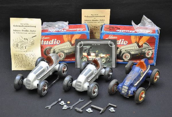 Schuco Studio Racer Lot: Original 1050 racer, missing steering wheel, mechanism not working, shows moderate playwear, C6. Two mint boxed 1982 reproductions, complete. Otherwise, C9-10