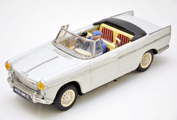 Scarce Joustra Peugeot 404 Convertible: Super detailed, 12" long, battery operated model. Litho tin with driver answering phone action. Special foreign battery required. Battery box is clean, shows light to moderate playwear, C7-7+