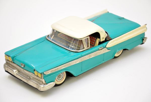 Bandai Ford Fairlane 500 Convertible: 11" Litho tin, battery operated, missing tether mechanism. Has crease in trunk lid. Otherwise, shows moderate playwear, C6-7