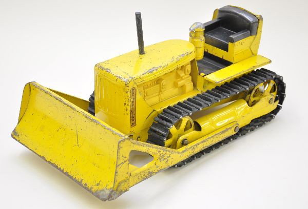 Scarce Doepke Model Toy Cat Dozer: The toughest of Doepke's pressed steel toys. 14" long with original treads. Shows moderate to heavy playwear, C5
