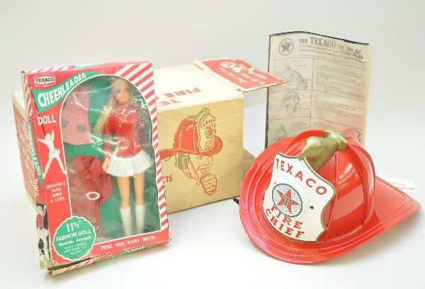 Boxed Texaco Premium Lot: Factory new Texaco Fire Chief hat with speaker, instructions and original box. Also, an unusual Texaco cheerleader doll. New in worn original box. C9-10