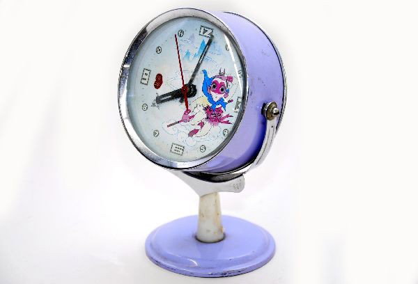 Rare Astro Boy Animated Clock: This is one of the tougher super hero clocks to find. 6" tall with a 3 1/2" face, eyes move with the second hand, has date indicator, mechanism runs at short intervals, probably needs a cleaning. Show