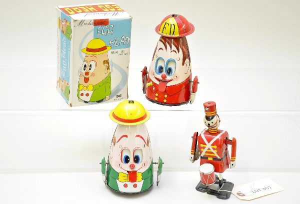 Wind-up Walking Toys Lot: Marx drumming soldier, missing drum sticks, C6+. 2 Echo Egg Head walkers, one having its original box. All mechanisms are functional, otherwise showing light playwear, C8