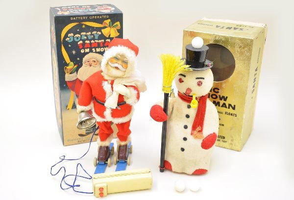 Boxed Christmas Battery Toys: Magic Snowman, complete & functional showing moderate playwear, C6-7. Alps Jolly Santa on snow, 12" tall, both mechanisms are functional. Both have original boxes with some inserts. Santa shows light 