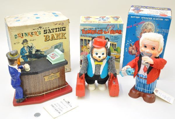 Boxed Battery Toys: Windson Drinking Savings Bank with envelope and coin; Yonezawas Tumbles The Bear; Blushing Willy. All mechanisms are functional, original boxes with some inserts show staining, C8