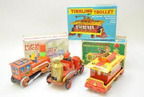 Boxed TM Battery Operated Vehicle Toys: Modern Toys, Japan. Tinkling Trolley dated 1965; old fashioned fire engine & hop-up locomotive. All functional, like new, with original boxes and some inserts, C9
