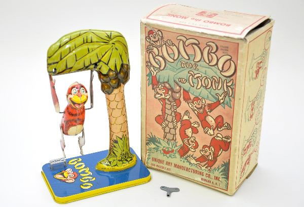 Boxed Unique Art Bimbo the Monkey: Litho tin, 12" tall, mechanism functional with key, scarce original box shows wear. Toy is like new, C9