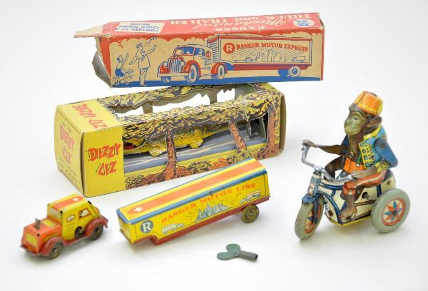 Early Tin Toy Lot: Boxed Ranger Motor Lines truck with key; German monkey on tricycle; boxed Automatic Toy Co. Dizzy Lizzy that is new in the box, C9. Otherwise, toys show light to moderate playwear, C7+