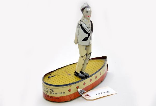 Strauss Jackie The Hornpipe Dancer: Unusual dancing jigger toy utilizing a sailor on boat, mechanism works intermittently, one replaced arm. Otherwise, shows light to moderate playwear, C7+