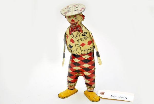 Unusual Strauss Tom Twist The Funny Clown: Litho tin, 8 1/2" tall, mechanism functional, clean. Shows moderate playwear, C6