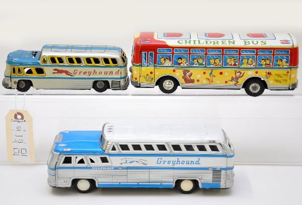 Japanese Tin Bus Lot: 10" Greyhound Scenic Cruiser; 9 1/2" TN Japan Children Bus; unusual KKK Japan Greyhound, 7" long, battery operated, untested. All show light to moderate playwear. Otherwise, C7+