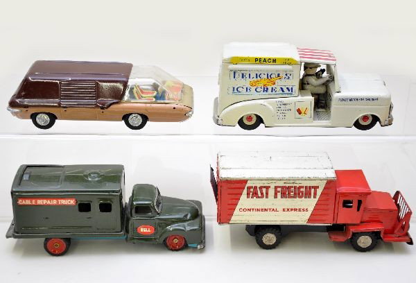 Commercial Tin Vehicle Lot: RHI 8" ice cream truck, missing rear hatch and one headlight; SSS Bell Telephone truck, no accessories; 8" Fast Freight truck, shows moderate playwear; 8" futuristic van. Otherwise, vehicles show ligh