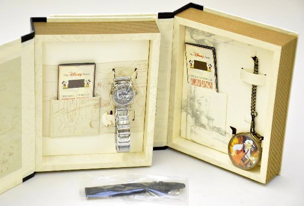 Boxed Disney Character Watch & Pocket Watch: Limited Edition Series II watches made by Fossil. DS-71 Steamboat Willie wrist watch, DS-49 Pinocchio pocket watch. Both appear factory new with original boxes, instructions and sleeves