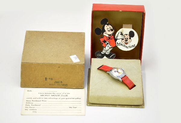 Boxed US Time Mickey Mouse Watch: Walt Disney Productions, 3/4" face with leather band, working, with pop-up display box and warranty card. Original box sleeve is worn. Appears factory new, C9