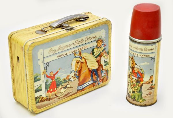 Early Roy Rogers Lunch Box: 1953-1954 Double R Bar Ranch, also includes Dale Evans and has scarce metal thermos, cup has 1" crack. Overall, shows light wear, but light and clean with some oxidation on chrome.
