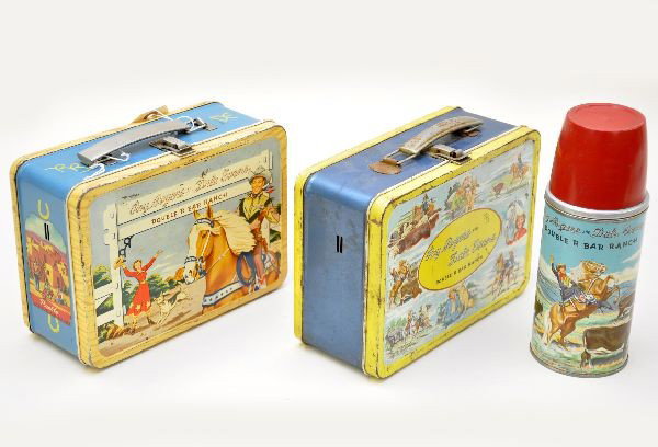 Early Roy Rogers Lunch Boxes: American Thermos Company, Double R Bar Ranch lunch box, circa 1955 version with decals on side and original thermos; 1955 different version than preceding box Double R. Bar Ranch. Both show moderate p