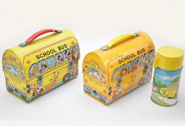 Two Disney School Bus Dome Lunch Boxes: Aladdin Industries dated 1961, with thermos and the yellow Spanish version marked Payua, made in Pascual, Spain. Shows light to moderate wear.