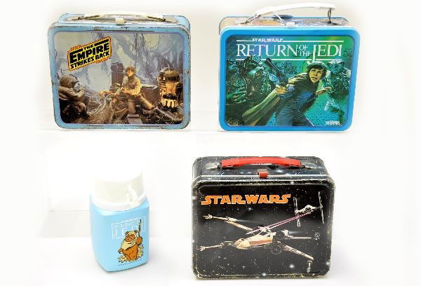 Star Wars Series Lunch Boxes: King-Seeley 1977, Star Wars; King-Seeley 1980, Empire Strikes Back. Both show light playwear. Thermos 1983, Return of the Jedi with plastic thermos, like new.