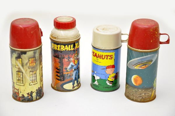 Lunch Box Thermos Lot: All metal thermos. Includes flying saucer dome, Peanuts, Fireball XL5 dome, missing cup, some rust; fire house dome, some light rust. All are dirty. Otherwise, all show moderate wear. C6