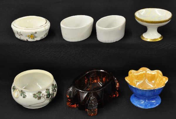 Antique Ceramic & Glass Salts: Large pressed glass amber salt, 2 small ceramic, blue/cream Noritake; small iridescent footed; painted Japanese ceramic (spider hairline in center bottom); low, small hand painted ceramic.