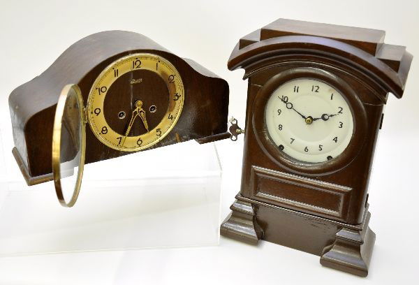 Seth Thomas & Judith Mantel Clocks: Early Seth Thomas arch top clock, 11" X 15 1/2", painted case with porcelain face, mechanism is functional with key which also unlocks case face; Judith waterfall style clock, mahogany veneer case has