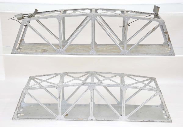 Two Marx Prototype Trestle Bridges: Both are steel bridges, 24" long. One is a non-illuminated bridge, hand lettered underneath "Model 1033A, dies YMY, dated January 7, 1941, Girard" and the other is an illuminated bridge hand lettered 