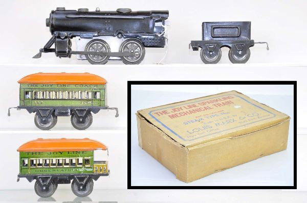 Boxed Marx Joy Line Set: Steam locomotive, mechanism functional with key; tender; 357 coach; 458 observation; unusual figure 8 track; original set box with unusual inserts, one corner split but clean, C8