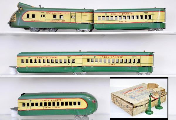 Boxed Marx M10000 Set No.1093: M10000 diesel loco, unfortunately drive wheels are fatigued and engine has stain on one side, scarce insert; 3 coaches; illuminated observation with insert. Accessories include semaphore and warning s