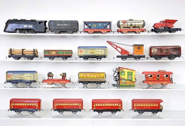 Large Group of Prewar Marx: Original owner group includes Commodore Vanderbilt loco, missing side rods; NTC tender; searchlight; hopper; tank car and caboose. Cars have red detailed frames. Also, flat with red dump truck; boxed 