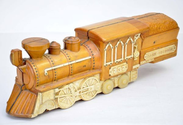 Very Unusual Marx Loco Display: According to Stan Troski this piece came from Mr. Beers from the Marx Erie factory. No other information is known. It is carved wood 18" long with plastic trim. Tender says Marx Electric, cab number i