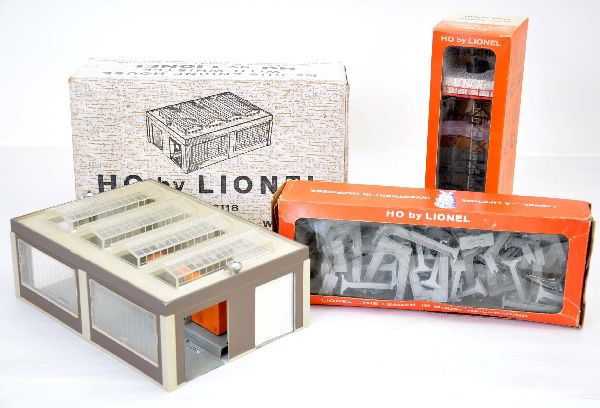 Three Boxed Lionel HO Accessories: 0118 engine house with whistle, 0197 rotating radar antennae, 0110 trestle set. Radar antennae is mint, others show light playwear.