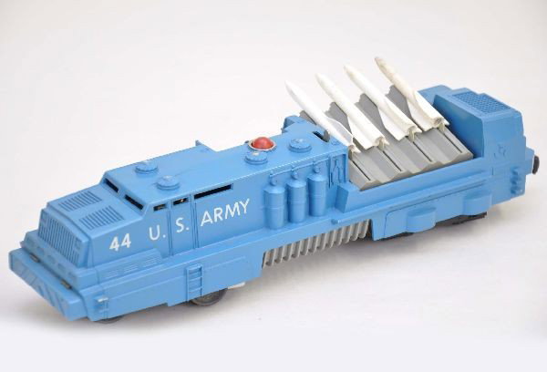 Lionel 44 U.S. Army Rocket Launcher: Very clean with all steps intact, missing control panel insert, has 1" crack near top vents, missiles are worn. Otherwise, shows light playwear, C7