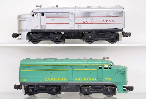 Lionel 228 and 216 Alco A Diesels: 216 Burlington and 228 Canadian National, both cowls are intact, both show moderate playwear, C6