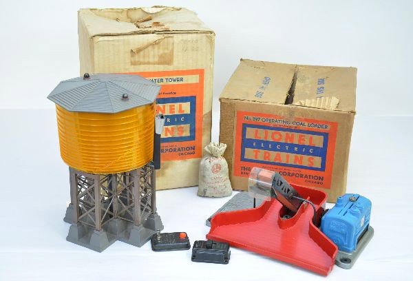 Boxed Lionel 30 and 397 Accessories: 30 water tower, complete and unbroken with controller; 397 operating coal loader, complete and intact. Both have original boxes, tower has insert but is missing one flap. Both show light playwear, C7+