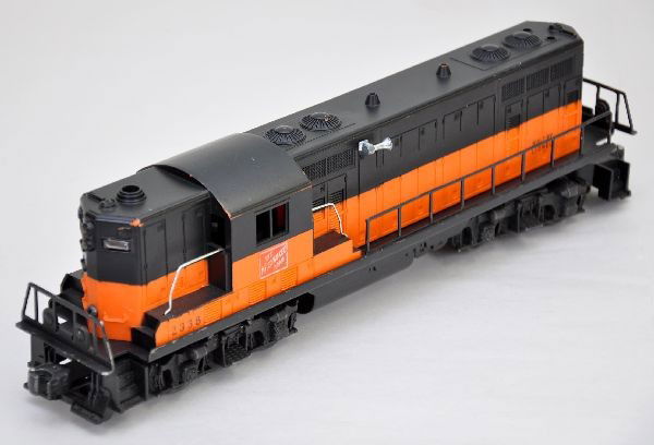 Scarce Lionel 2338 Orange Cab GP-7 Diesel: Milwaukee Road logos are 90%, black painted over orange mold version, first production with orange cab. Shows light to moderate playwear, C7