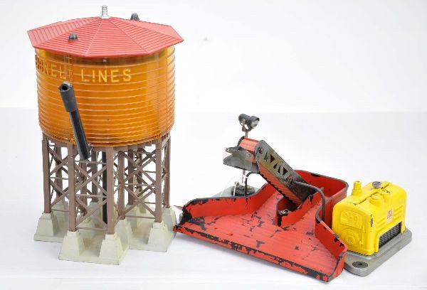 2 Early Lionel Accessories: First series 397 coal loader with yellow engine cover, bin is heavily flaking, shield is broken; 38 pumping water tower, no visible corrosion except to top screen inside. Roof has a lip chip on 1/8" o