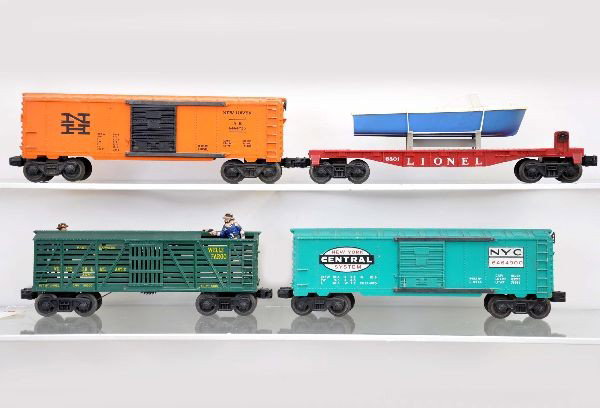 4 Late Lionel Freight Cars: 6801-50 flat with blue boat; 6464-900 NYC boxcar, Type 4; 3370 sheriff and outlaw car, outlaw has 30% flaking paint; 6464-725 New Haven boxcar, shows wear on ladders one side. Otherwise, all show ligh