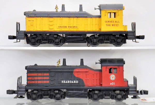 Lionel 601 and 613 NW2 Diesels: 601 Seaboard has screw crack, and some battery damage; 613 UP NW2 switcher, hairline screw crack and edge chip on cab room. Otherwise, shows moderate to heavy playwear, C5+-6