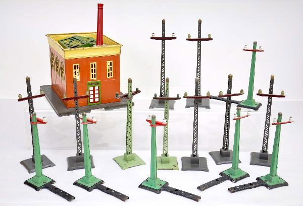 Lionel Power Station and Telegraph Posts: 436 power station, replaced chimney, some rust spots on top panel, shows moderate playwear, C6-; 7 #60 telegraph posts in gray, clean and shiny, C8; 2 #60 posts in light green, with some minor flaking