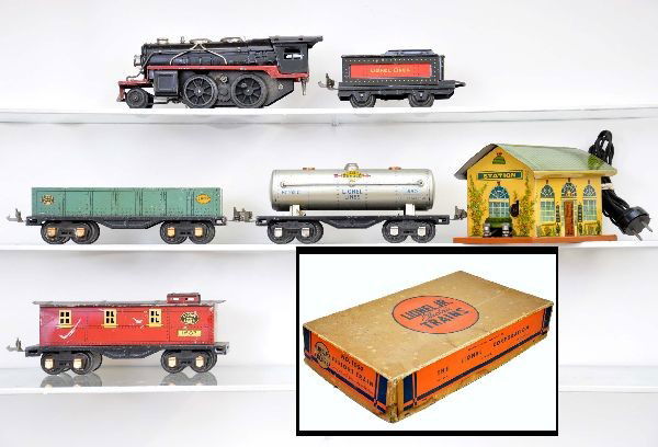 Boxed Lionel Junior Freight Set 1054: 1681 steam locomotive, missing one side rod, pony wheel is fatigued; 1016 tender; 1677 gondola; 1680 Sunoco tank car; 1682 caboose; 1012 transformer station, track, switches, original set box missing