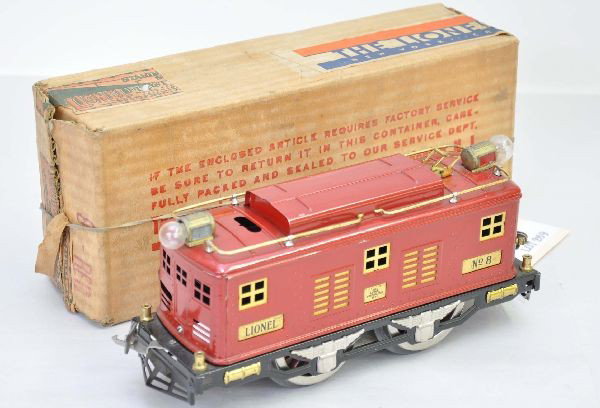 Scarce Boxed Ives Body Lionel No.8 Locomotive: Standard gauge. Clean and shiny, Ives body with horizontal reverse slot in roof, headlights show light fatigue. Original box has both early and late tape, shows light playwear, C8