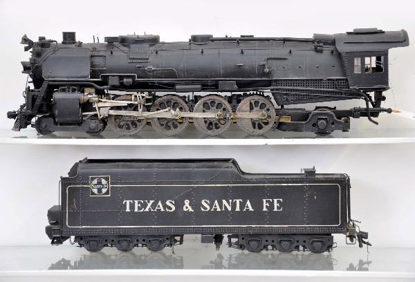 O-Scale Texas & Santa Fe Steam Locomotive: Painted tin and cast with nickel trim. 482 loco with long haul tender, set up for outside third rail operation, 28" overall length, missing some side rods, one side and may be missing some minor trim.