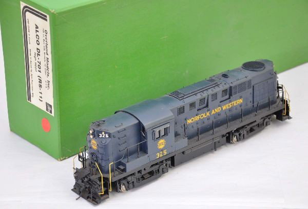 Overland Brass O-Scale N&W Alco DL-701: Factory painted brass, two rail, 14" long, one truck needs minor repair original box with insert. Otherwise, shows light playwear, C8
