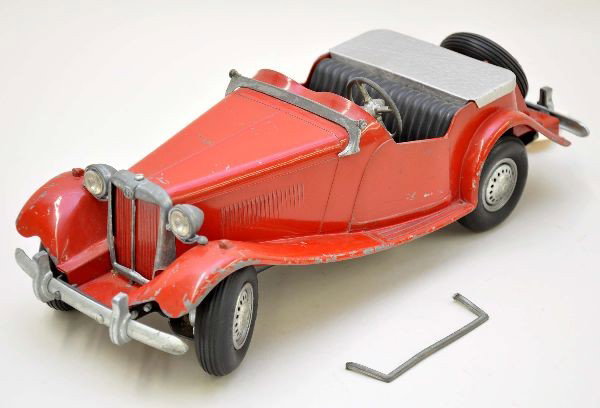 Doepke MG Convertible: Factory painted die cast, 15" long, windshield is incomplete, as is the dash decal, but a replacement decal is included. Toy shows moderate playwear. Otherwise, C6
