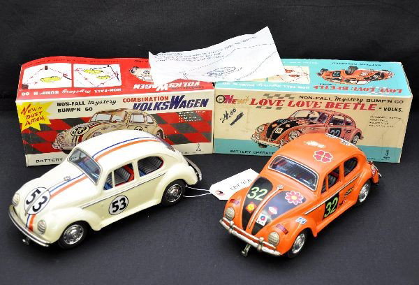 Two Boxed VW Bug Cars, Herbie!: Both by Taiyo Japan, 10" long, and both have blinking motor lights and mystery action. Herbie is near mint with instructions, orange Beetle has a rub on its roof and shows light playwear, both have th