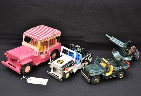 3 Japanese Tin Jeep Battery Toys: ATC Surry Jeep, 10" long, mystery action, headlights (missing 1 bulb), smoking exhaust pipe; searchlight Jeep with gun crew, moves forward with lighted searchlight, gun trailer swivels when pulled; Ic